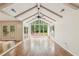 Sun-filled room with vaulted ceilings, large windows, and access to the backyard at 11540 Northgate Way, Roswell, GA 30075