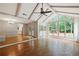 Spacious sun room featuring vaulted ceilings, hardwood floors, and a view of the backyard at 11540 Northgate Way, Roswell, GA 30075