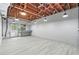 A finished basement featuring white walls, gray vinyl floors, and hanging light fixtures at 1725 Timberland Ne Rd, Atlanta, GA 30345