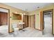Bathroom in need of remodeling features a small sink, toilet, and a door leading to another room at 1725 Timberland Ne Rd, Atlanta, GA 30345