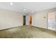 Bedroom featuring neutral walls, carpet, and an open door leading to a bathroom with a toilet at 1725 Timberland Ne Rd, Atlanta, GA 30345