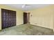 Bedroom featuring closet doors and yellow walls with a ceiling fan at 1725 Timberland Ne Rd, Atlanta, GA 30345