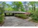 Charming single story home with mature landscaping and a covered parking area nestled in a wooded setting at 1725 Timberland Ne Rd, Atlanta, GA 30345