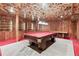 A distinctive game room boasting a pool table, retro decor, and uniquely-designed ceilings at 1725 Timberland Ne Rd, Atlanta, GA 30345