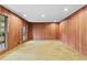 Bright living room with wood paneling, carpet and great natural light from the large windows. Lots of space at 1725 Timberland Ne Rd, Atlanta, GA 30345