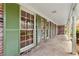 Inviting covered front porch with brick accents and view of the well-manicured yard. Windows galore! at 1725 Timberland Ne Rd, Atlanta, GA 30345