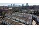 Aerial view of the neighborhood showcases the townhomes near the city skyline at 215 Semel Nw Dr # 455, Atlanta, GA 30309
