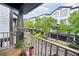 Cozy covered balcony with a serene view of the neighborhood's modern townhome facades at 215 Semel Nw Dr # 455, Atlanta, GA 30309