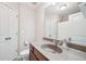 Well-lit bathroom featuring granite counters, modern fixtures, and a large storage closet at 215 Semel Nw Dr # 455, Atlanta, GA 30309