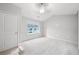 Bright bedroom featuring neutral tones, a ceiling fan, and lots of natural light from a bright window at 215 Semel Nw Dr # 455, Atlanta, GA 30309