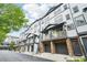 Modern townhome exteriors with a mix of neutral tones, covered balconies and private driveways at 215 Semel Nw Dr # 455, Atlanta, GA 30309