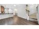Open-concept living area featuring hardwood floors and staircase access, perfect for modern living at 215 Semel Nw Dr # 455, Atlanta, GA 30309