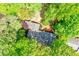 Aerial view of a house with a dark gray roof surrounded by lush green trees at 2840 Wendy Ln, Marietta, GA 30062
