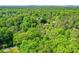 A captivating aerial shot of a property nestled among a canopy of lush green trees in a serene setting at 2840 Wendy Ln, Marietta, GA 30062