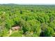 A captivating aerial shot of a property nestled among a canopy of lush green trees in a serene setting at 2840 Wendy Ln, Marietta, GA 30062