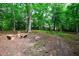 Landscaped backyard with stone benches and table, offering a serene view of the residence at 2840 Wendy Ln, Marietta, GA 30062