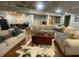 Finished basement featuring a large sectional sofa, a cow hide rug, and a wood coffee table at 2840 Wendy Ln, Marietta, GA 30062