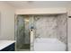 Stylish bathroom showcasing a frameless glass shower and a modern soaking tub at 2840 Wendy Ln, Marietta, GA 30062