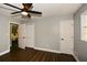 Bedroom featuring a ceiling fan, closet, and updated floors for a relaxing atmosphere at 2840 Wendy Ln, Marietta, GA 30062