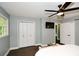 Comfortable bedroom featuring a ceiling fan, closet, and television for a relaxing atmosphere at 2840 Wendy Ln, Marietta, GA 30062