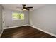 Bedroom featuring a ceiling fan, view from window, and modern floors for a relaxing atmosphere at 2840 Wendy Ln, Marietta, GA 30062
