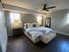 This main bedroom has windows, a fan, and a comfy looking bed with bench at its foot at 2840 Wendy Ln, Marietta, GA 30062