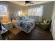 This bedroom features hardwood floors, a ceiling fan, and a bright window at 2840 Wendy Ln, Marietta, GA 30062