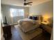 Cozy bedroom features natural lighting, hardwood floors, a ceiling fan, and relaxing decor at 2840 Wendy Ln, Marietta, GA 30062