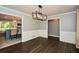 Open dining room with dark hardwood floors, access to kitchen and living room at 2840 Wendy Ln, Marietta, GA 30062