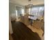 Bright dining room features a large window, dark wood floors, modern light fixture, and neutral furnishings at 2840 Wendy Ln, Marietta, GA 30062