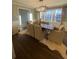Bright dining room features a large window, dark wood floors, modern light fixture, and neutral furnishings at 2840 Wendy Ln, Marietta, GA 30062