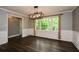 Elegant dining space with modern chandelier, wainscoting, and hardwood floors at 2840 Wendy Ln, Marietta, GA 30062