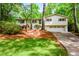 Charming split-level home with a lush front yard and a two-car garage at 2840 Wendy Ln, Marietta, GA 30062