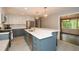 Updated kitchen features quartz counters, tile backsplash, stainless appliances, and modern lighting at 2840 Wendy Ln, Marietta, GA 30062