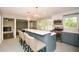 Spacious kitchen with island seating, stainless steel appliances, and views of the fireplace in the other room at 2840 Wendy Ln, Marietta, GA 30062