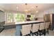 Modern kitchen featuring an island with seating, stainless steel appliances, and ample counter space at 2840 Wendy Ln, Marietta, GA 30062