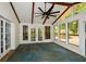 Open sunroom features tile floors, exposed wood beams, and lots of natural light at 2840 Wendy Ln, Marietta, GA 30062