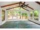 Bright sunroom with vaulted ceilings, lots of windows, and a ceiling fan at 2840 Wendy Ln, Marietta, GA 30062