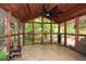 Screened sunroom featuring a wood ceiling, tile floor, and views of the surrounding lush greenery at 2840 Wendy Ln, Marietta, GA 30062