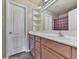 Bathroom with vanity, sink, cabinets, and open shelving for storage at 319 Franklin Ln, Acworth, GA 30102