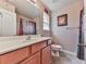Bathroom with vanity, sink, cabinets, and open shelving for storage at 319 Franklin Ln, Acworth, GA 30102