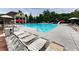 View of the community pool with lounge chairs and umbrellas at 319 Franklin Ln, Acworth, GA 30102