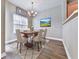 Formal dining room with elegant chandelier and seating for six, ideal for hosting dinner parties at 319 Franklin Ln, Acworth, GA 30102