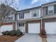 Charming townhouse with attached garage, stone accents, and well-maintained landscaping at 319 Franklin Ln, Acworth, GA 30102