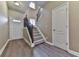 Inviting entryway with elegant staircase and hardwood floors, creating a welcoming first impression for guests at 319 Franklin Ln, Acworth, GA 30102