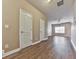 Hallway with hardwood floors and two white doors that lead to other rooms of the home at 319 Franklin Ln, Acworth, GA 30102
