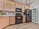 Well-equipped kitchen featuring stainless steel appliances, ample cabinet space, and stylish backsplash at 319 Franklin Ln, Acworth, GA 30102