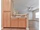 Kitchenette includes wooden cabinets and a counter space with a partial wall view of a living area at 319 Franklin Ln, Acworth, GA 30102