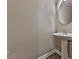 Well-lit powder room features modern pedestal sink and hardwood floors, adding convenience for guests at 319 Franklin Ln, Acworth, GA 30102