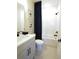 A cozy bathroom featuring a tub and shower combo, a toilet, and a sink vanity at 3552 Cedarvale Ct, Powder Springs, GA 30127
